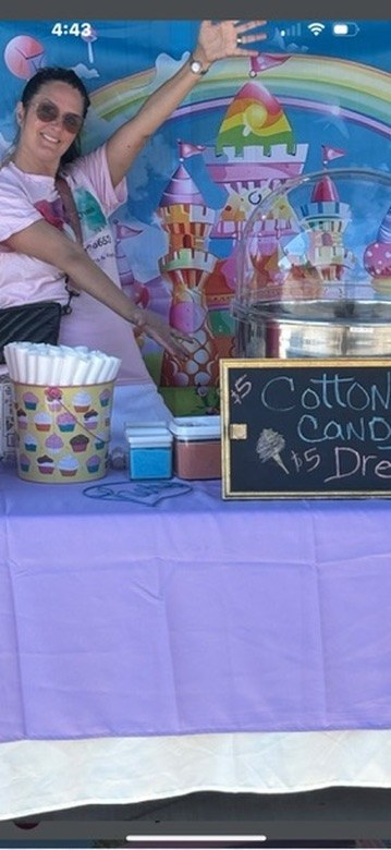 Candy castle themed cotton candy booth ready for a colorful celebration
