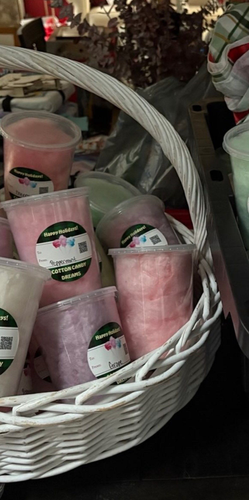 Holiday cotton candy tubs arranged in a gift basket