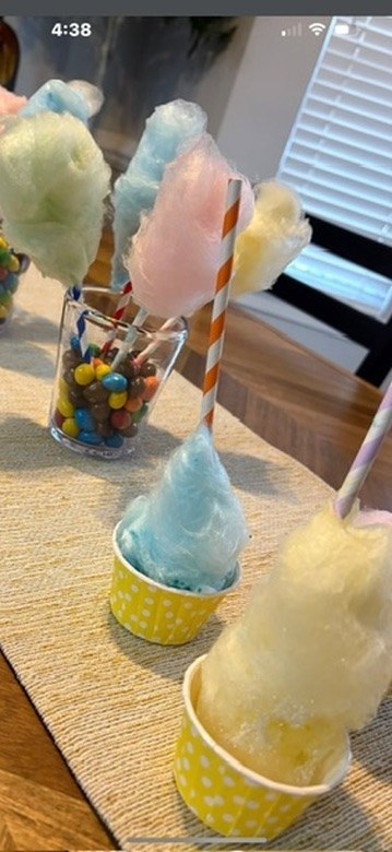 Colorful mini cotton candy treats served in cheerful party cups