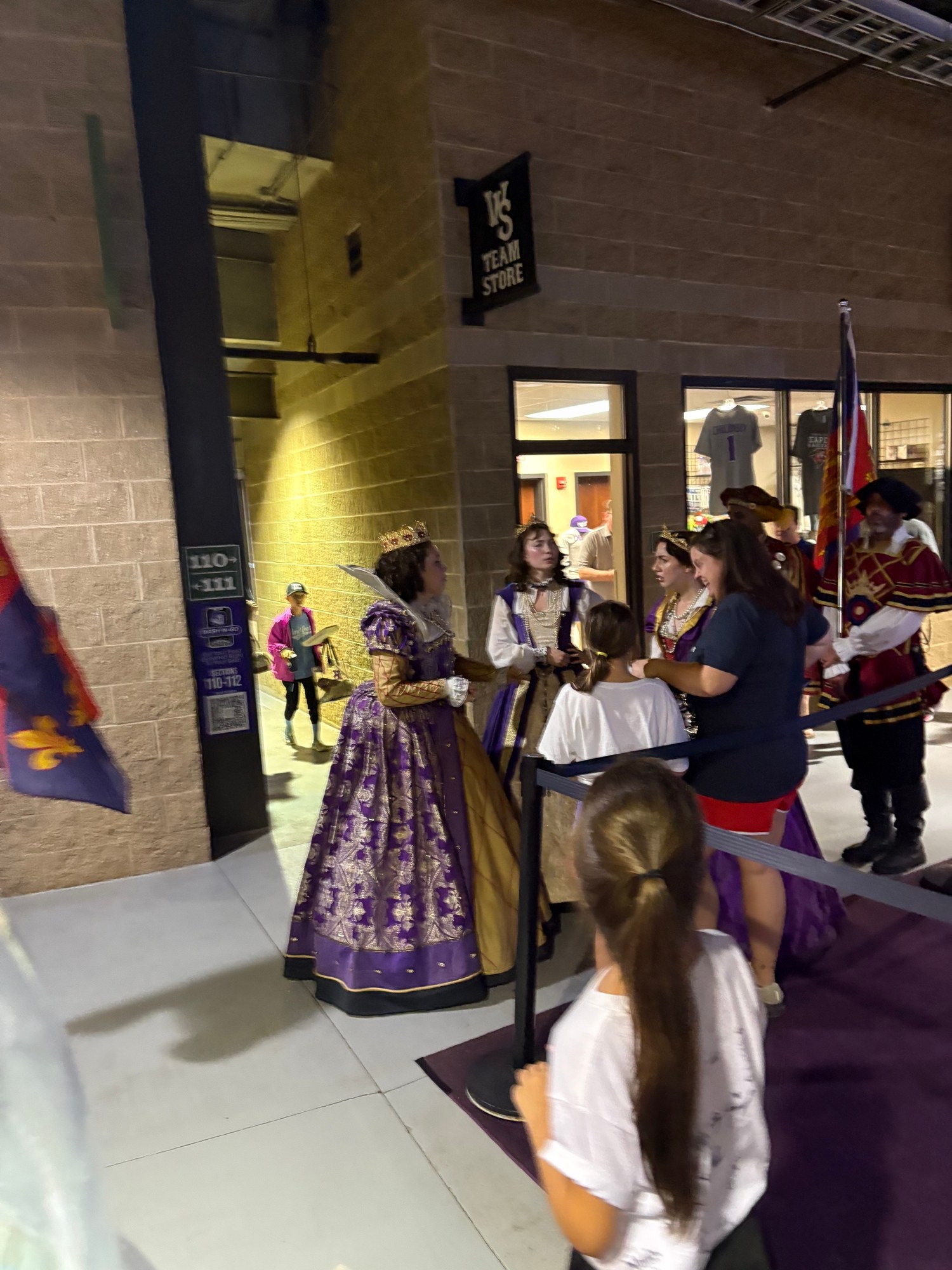 Renaissance festival performers greeting guests at a Winston-Salem Dash game
