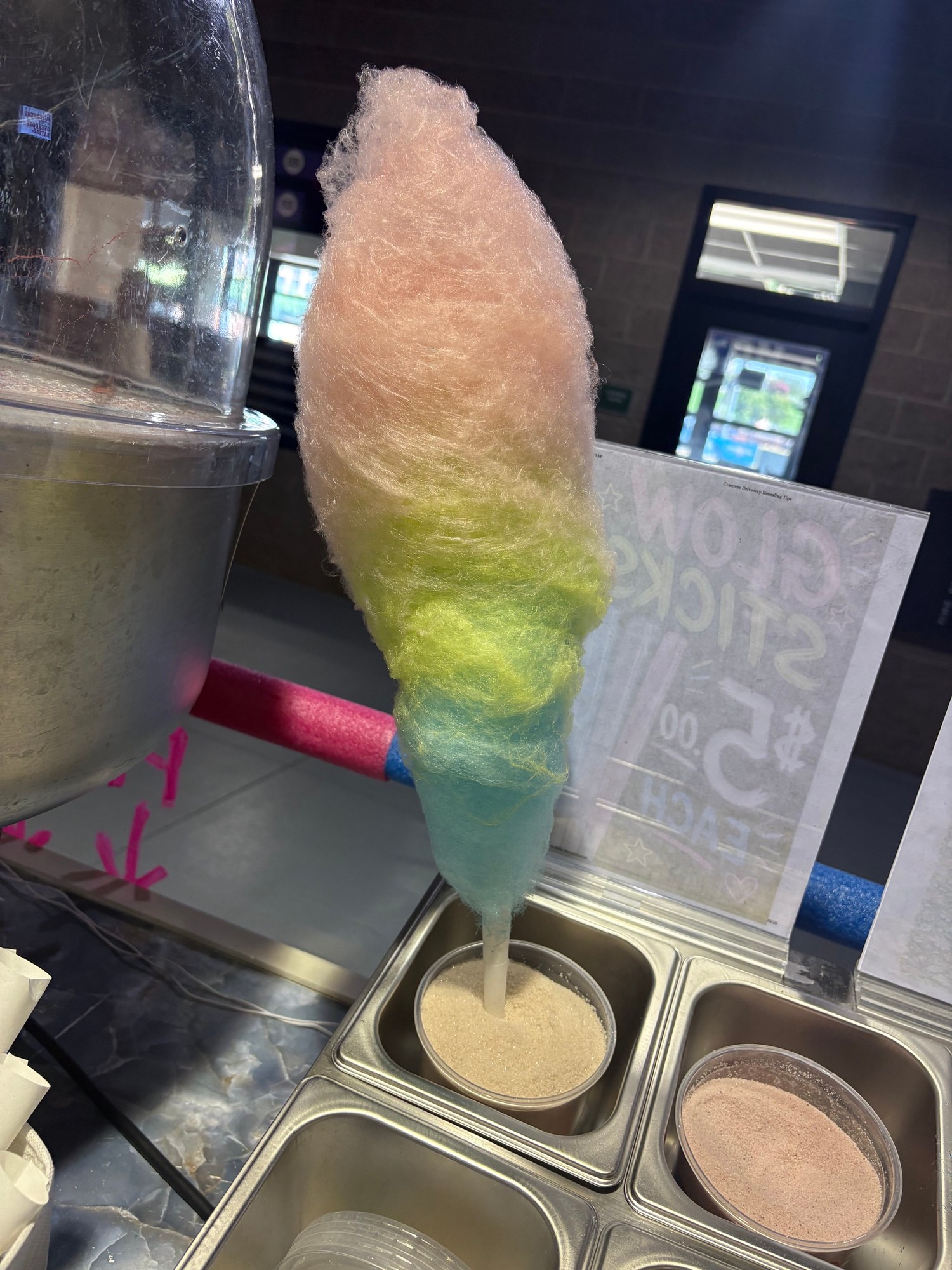 Fresh multicolor cotton candy prepared at the spinning station