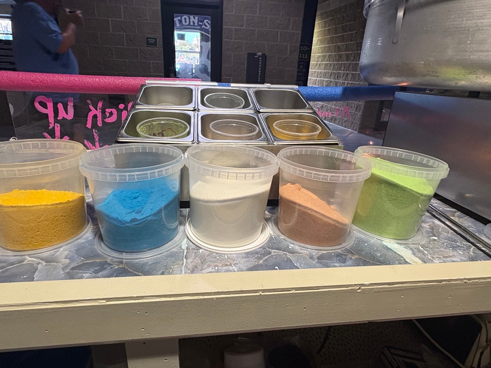 Fresh cotton candy in colorful flavors ready for guests