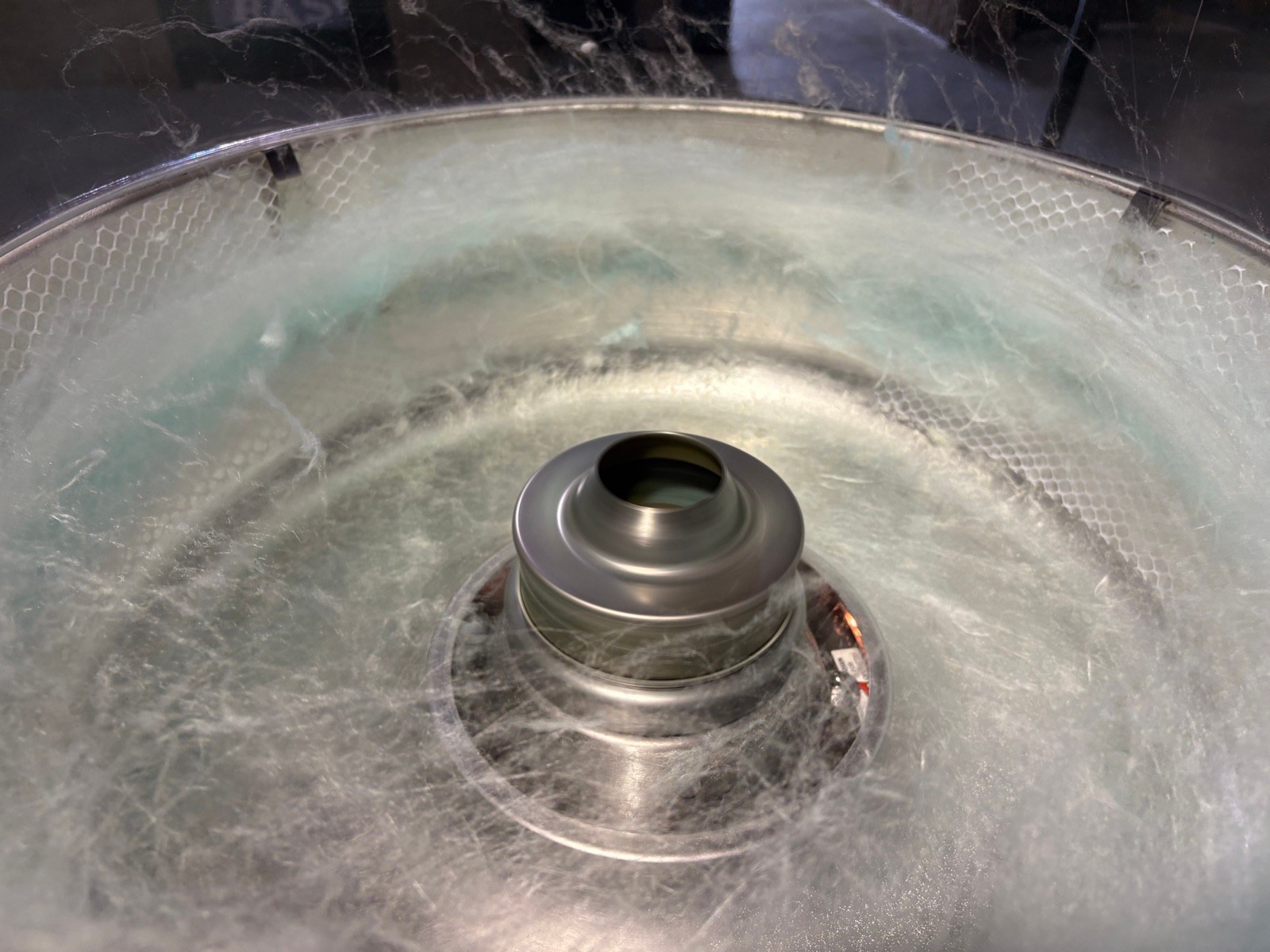 Fresh cotton candy spinning at the machine