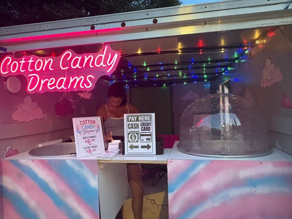 Cotton Candy Dreams trailer counter ready for guests at an evening community event