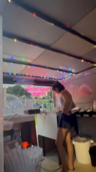 Cotton Candy Dreams team preparing treats inside the trailer at a community event